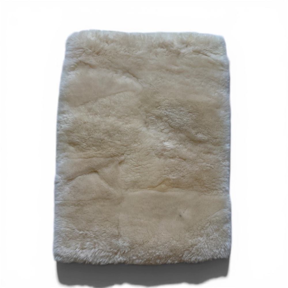 Plush Cream Sheepskin Rug Timothy Oulton Sample. Small smudge stain